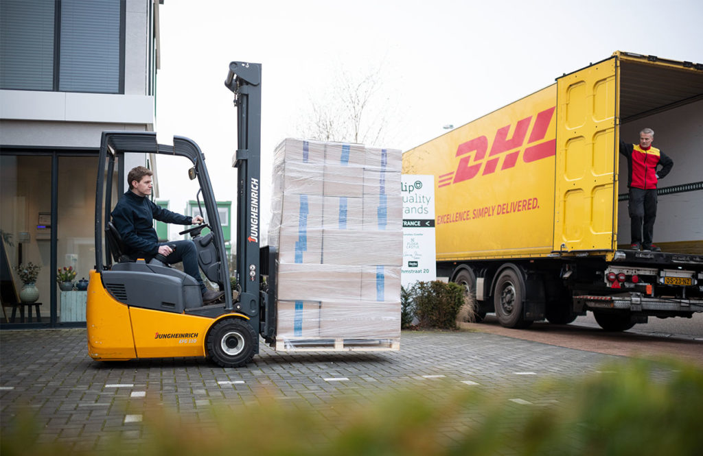 Storing packages on a delivery van for DHL Global Mail.