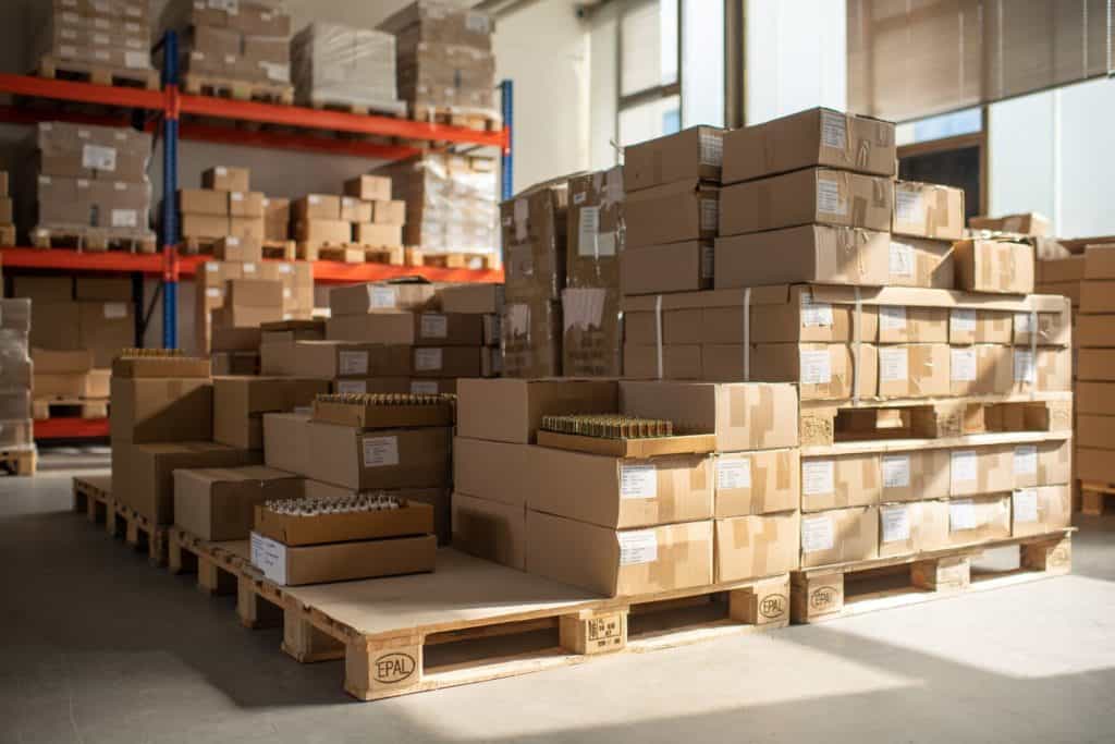 Boxes in warehouses on wooden palettes | E-commerce Logistics